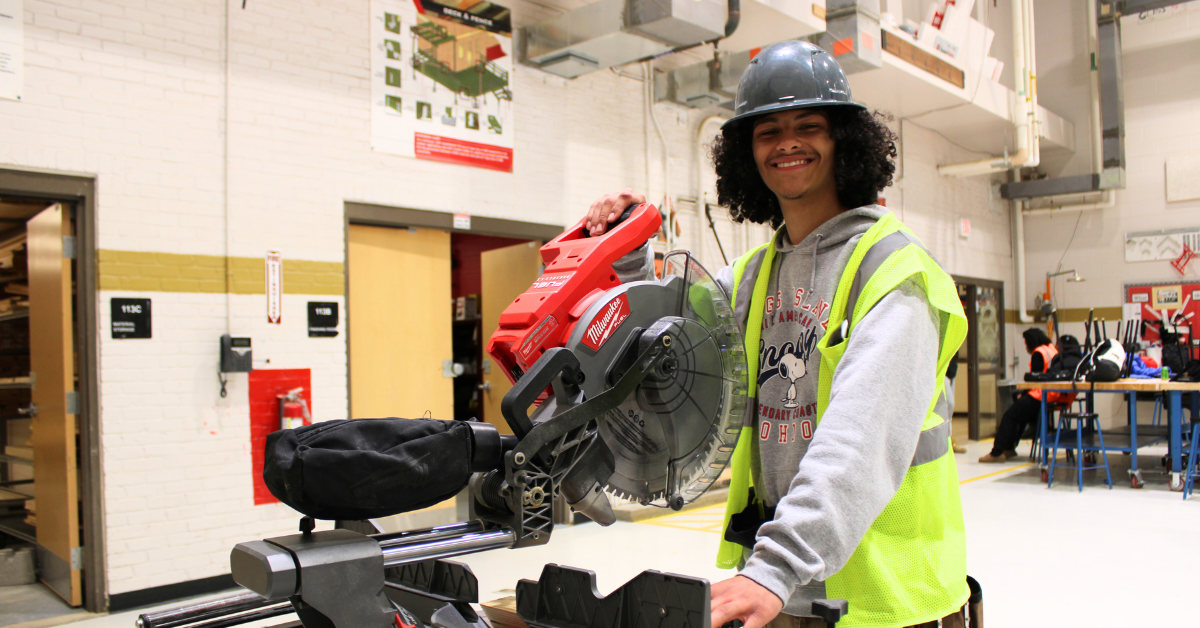 student operating machinery